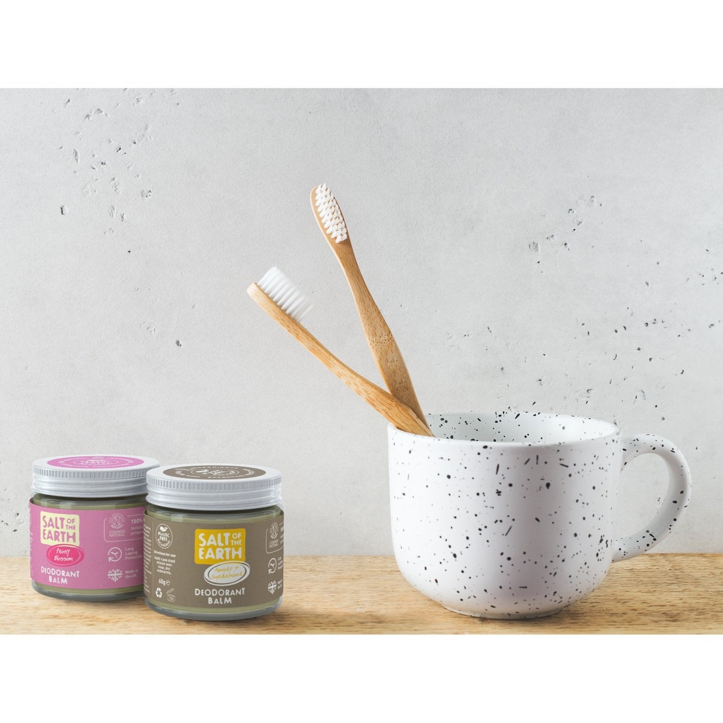 Natural deodorant balms in bathroom. Peony blossom and amber & sandalwood